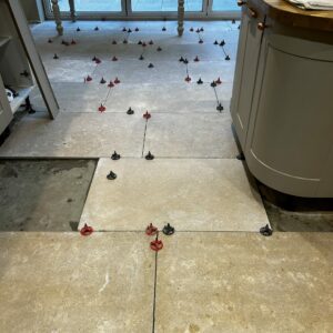 3mm tile spacer and spinner cap in use for interior tile floor